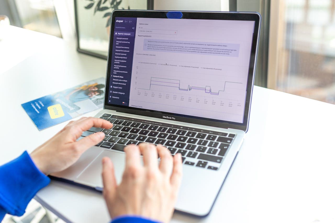 Merchant reviewing ecommerce analytics on a laptop